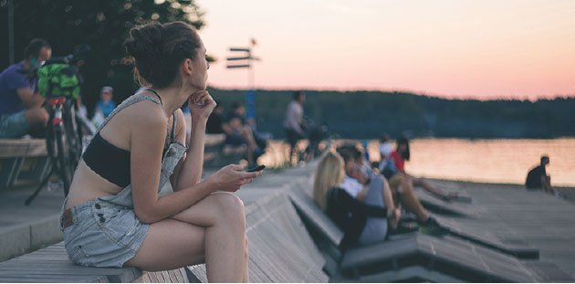 girl sitting with phone